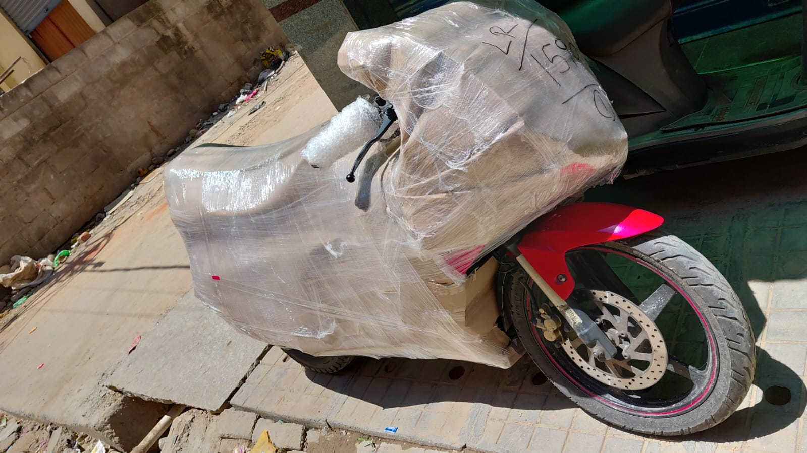 Motorcycle wrapped and secured for transport by Union Packers and Movers Bangalore