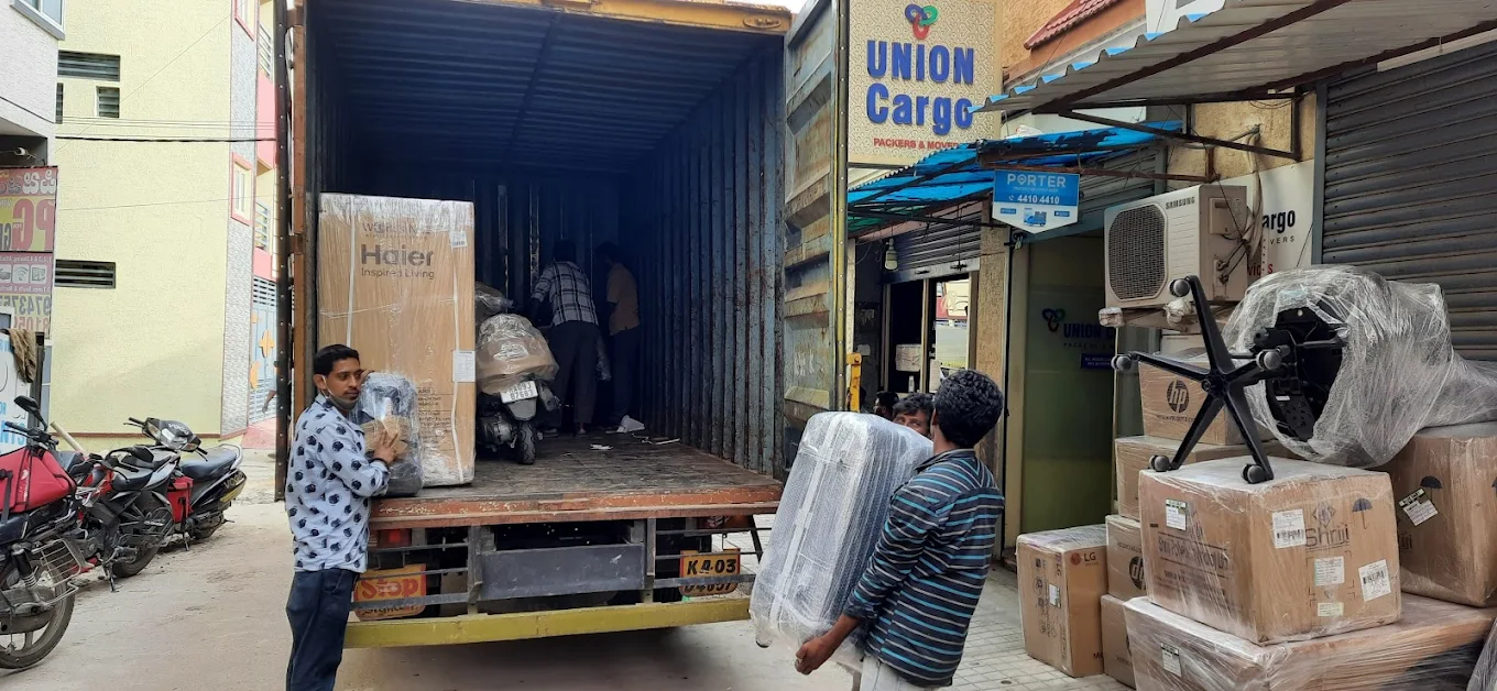 Union Packers and Movers Bangalore team loading household goods into a branded moving truck